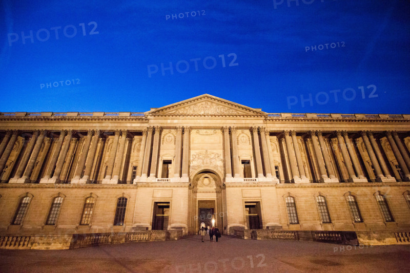 The Claude Perrault’s Colonnade in Paris by night, France. It is the easternmost façade of the famous Palais du Louvre.