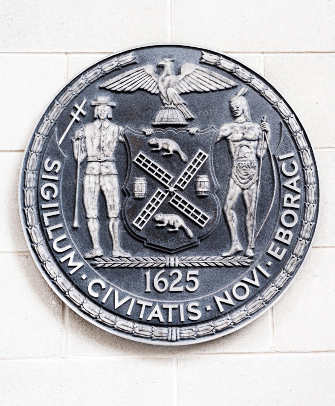 The seal of the City of New York on the side of a school in New York on Saturday, April 15, 2017. (© Richard B. Levine)