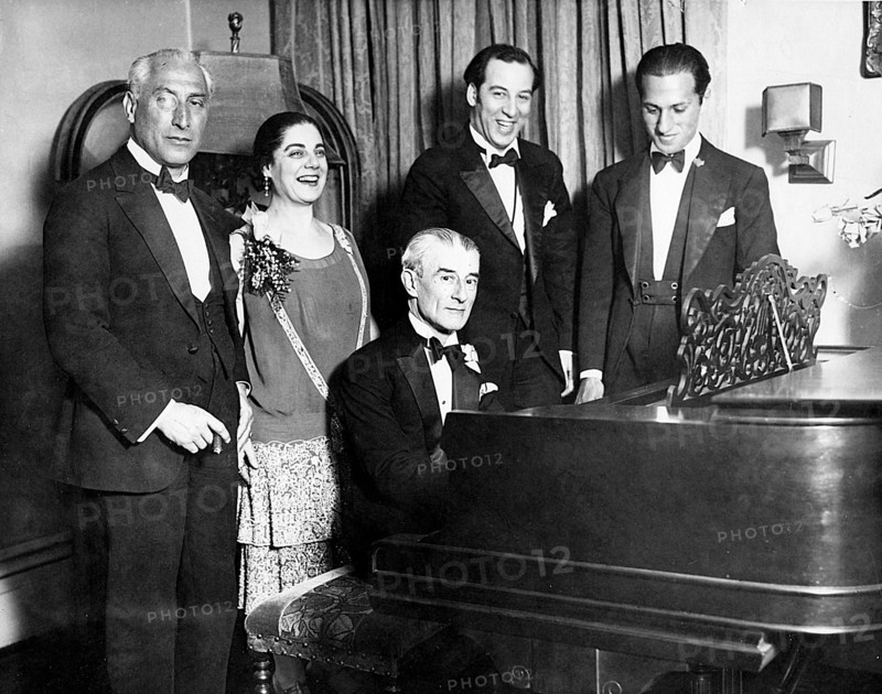 MAURICE RAVEL French composer at piano in 1928 celebrating his birthday with George Gershwin at right and Eva Gauthier