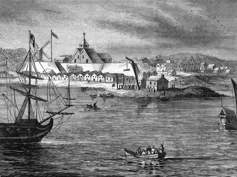 Lithograph depicting a view of Fort Amsterdam, a fort on the southern tip of Manhattan that was the administrative headquarters for the Dutch and then English/British rule of New York from 1625 or 1626 until being torn down in 1790 after the American Revolution, at about 1650, as seen from the water, the fort and other structures in the background, New York, 1800. From the New York Public Library.