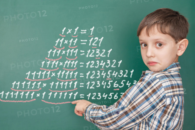 Education mathematics concept with a surprised boy