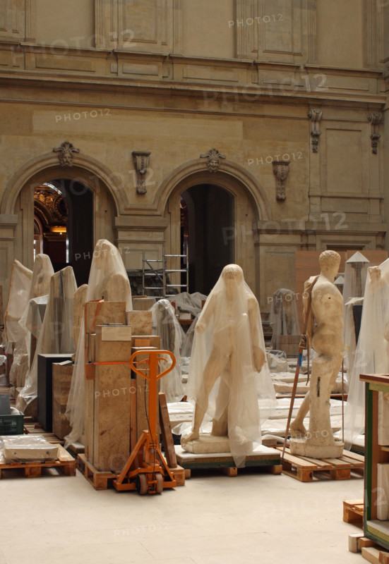 12 April 2016 - Paris, France: Statues and sculptures packed in foil in a storage room of the Louvre museum in Paris.