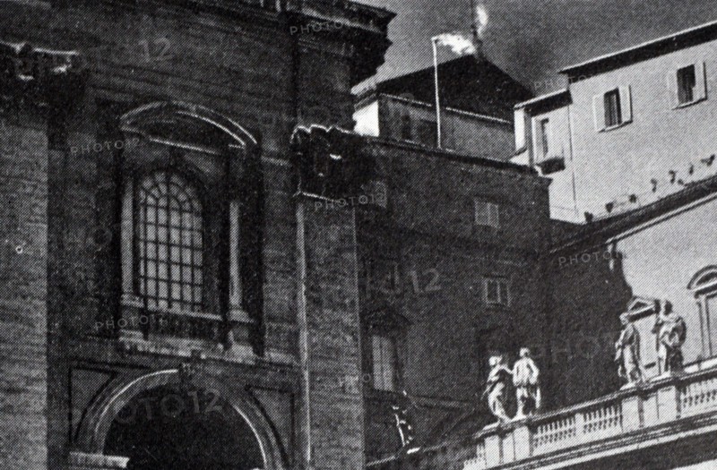 Black and white photograph of white smoke coming out of the chimney indicating that a new pope had been elected.