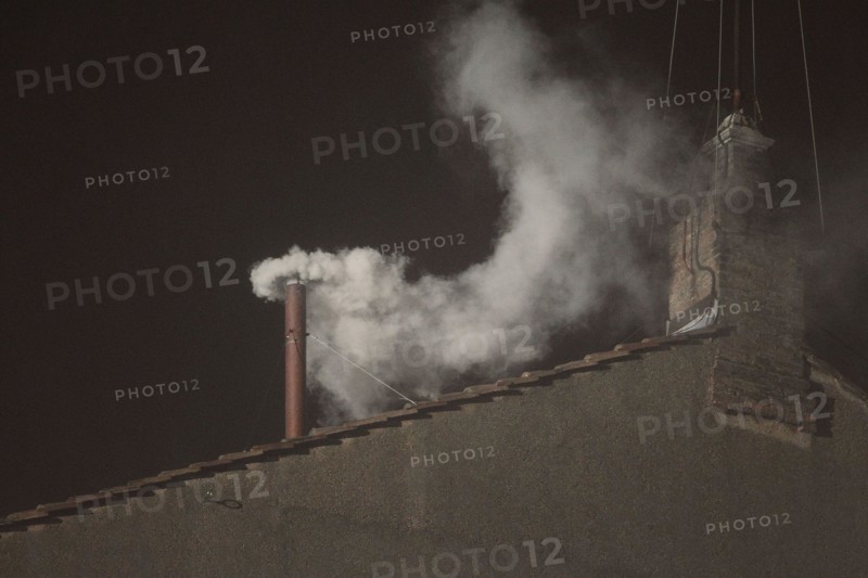 March 13, 2013 - Vatican City, Italy - White smoke rises from the chimney on the roof of the Sistine Chapel meaning that cardinals elected a new pope on the second day of their secret conclave on March 13, 2013 at the Vatican (Credit Image: © Future-Image/ZUMAPRESS.com)