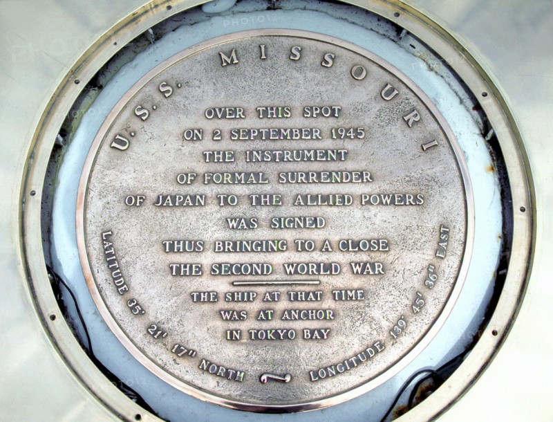 USA/Japan: Plaque on the USS Missouri commemorating the signing of the Japanese surrender at the end of World War II, September 2, 1945.  A close-up of the plaque aboard the battleship USS Missouri (BB-63) commemorating the end of World War II.  The official surrender by Japan took place aboard the Missouri on 2 September 1945, with Shigemitsu Mamoru, representative of the Japanese emperor, signing surrender documents in the presence of Admiral Chester Nimitz, representing the United States Navy, and General Douglas MacArthur, serving as the supreme commander of Allied forces for the ceremony.