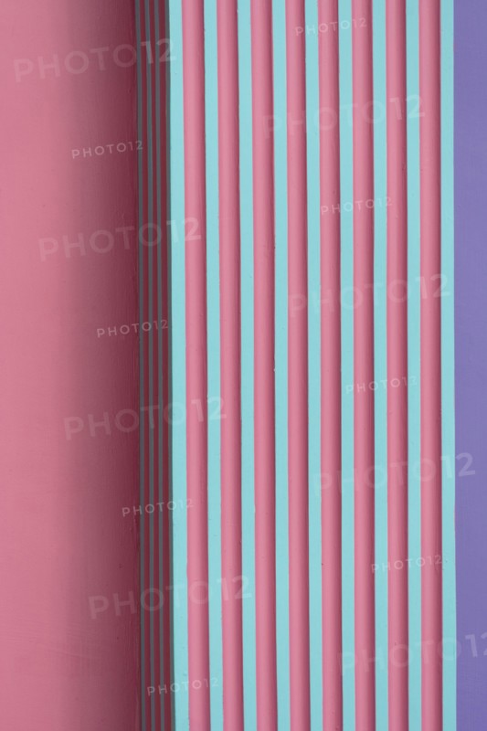 vertical pink green purple striped concrete or cement wall architecture abstract background