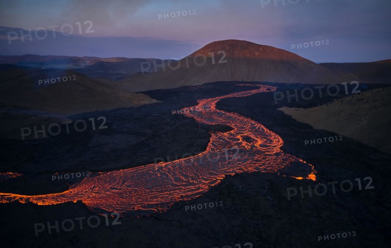 Flowing lava in volcanic mountains