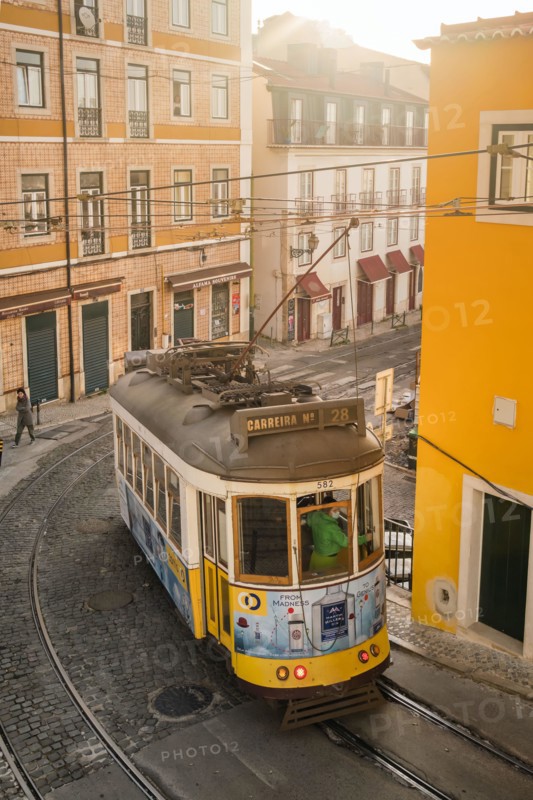 Old tram on the cobbled street in Lisbon, Portugal