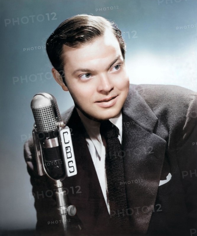 Portrait photograph of Orson Welles, promoting the premiere broadcast of Orson Welles and his Mercury Theater (Orson Welles Show) September 15, 1941, on CBS Radio - colorized photo