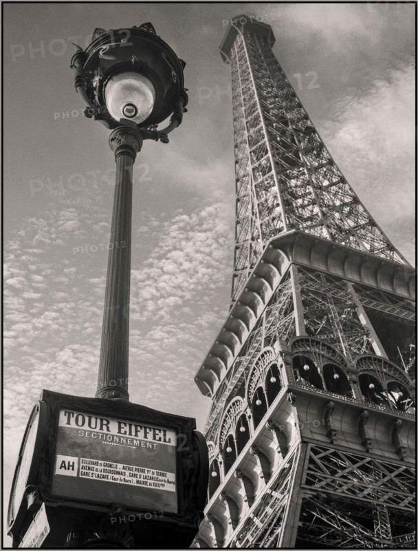 Vintage 1930s Eiffel Tower and a bus stop "Tour Eiffel" Paris France B&W retro vintage iconic cityscape 1935 Location : France, Paris Photographer  Willem van de Poll,