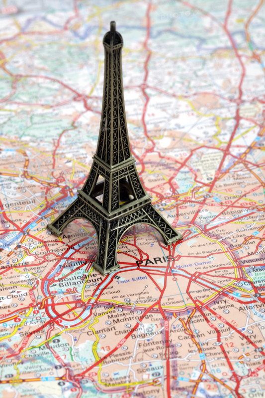 Statue of Eiffel Tower on map of Paris
