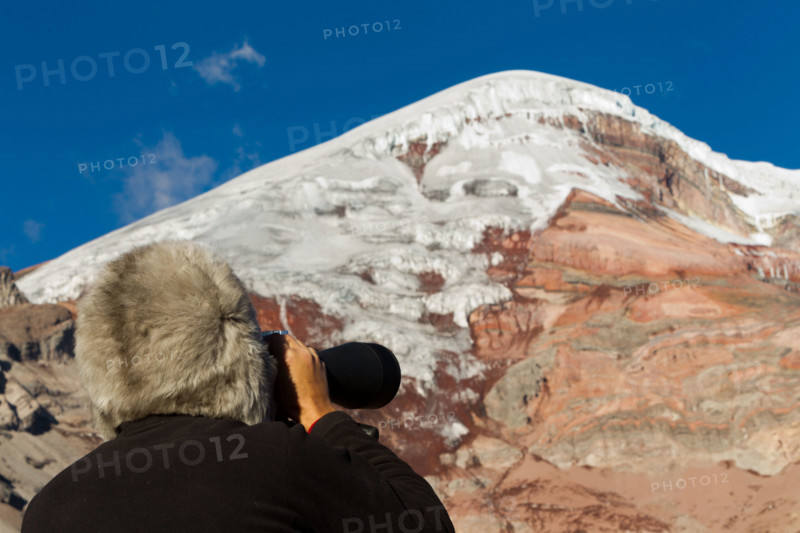 Mountain Tracker Studying The Peak Of Chimborazo Volcano For Avalanches With A Huge Binocular Alpaca Hat