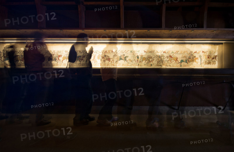 Bayeux, France. Tourists look at the famous tapestry which depicts the events leading to the Norman conquest of England in 1066.