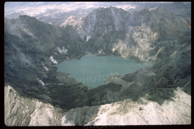 Mount Pinatubo's caldera and crater lake, formed after the catastrophic eruption in 1991, remains a significant geological site. The crater lake, located in the Philippines, was created by volcanic activity and is now a popular tourist destination. It showcases the recovery of nature after a volcanic event, surrounded by rugged terrain and lush vegetation.