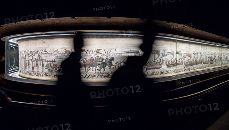 Bayeux, France. Tourists pass by the famous tapestry which depicts the events leading to the Norman conquest of England in 1066.