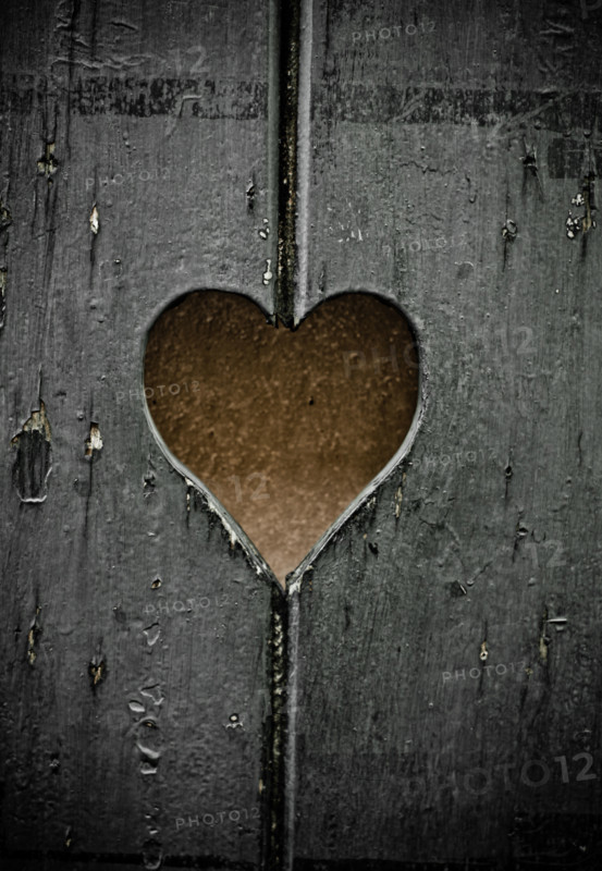 Wooden symbol - the heart cut out in boards