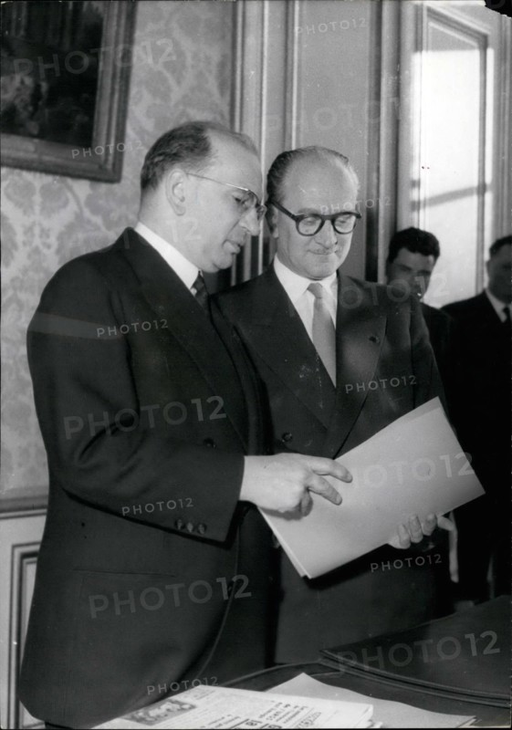 Feb. 02, 1956 - New Premier Takes Over: M. Guy Mollet, the new French Prime Minister, took over his office from his predecessor, m. Edgar Faure, at Matignon, prime minister's official residence this afternoon. m. Guy mollet and Edgar Faure during the ceremony.