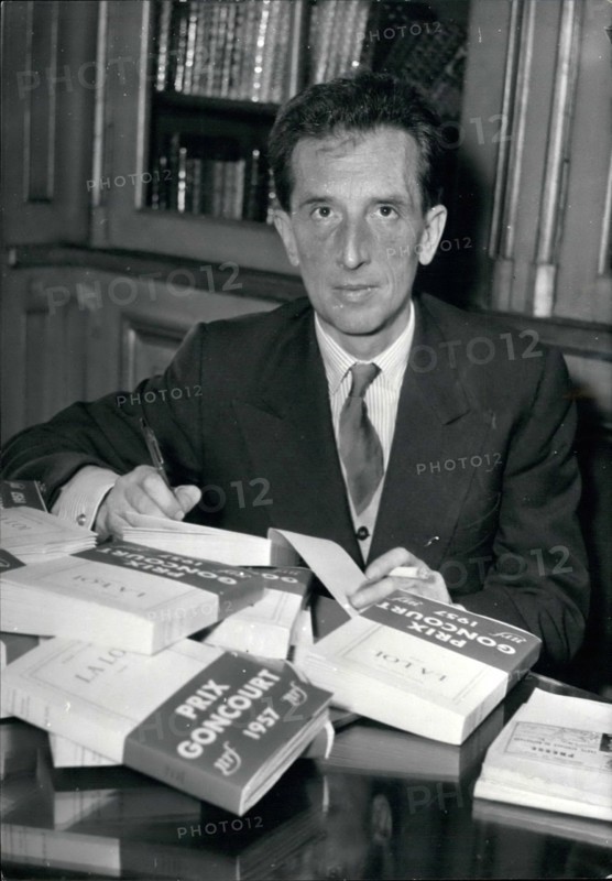 Dec. 12, 1957 - Prix Goncourt the most prized literary award goes to Roger Vailland. Roger Vailland, 50, writer and journalist, was awarded the Prix Goncourt, the famous literary awad, for his book La Loi today. Vailland's father was a farmer from French Savoy. OPS: Roger Vailland autographs his prize winning book at his publisher's this afternoon, Dec. 2nd/57