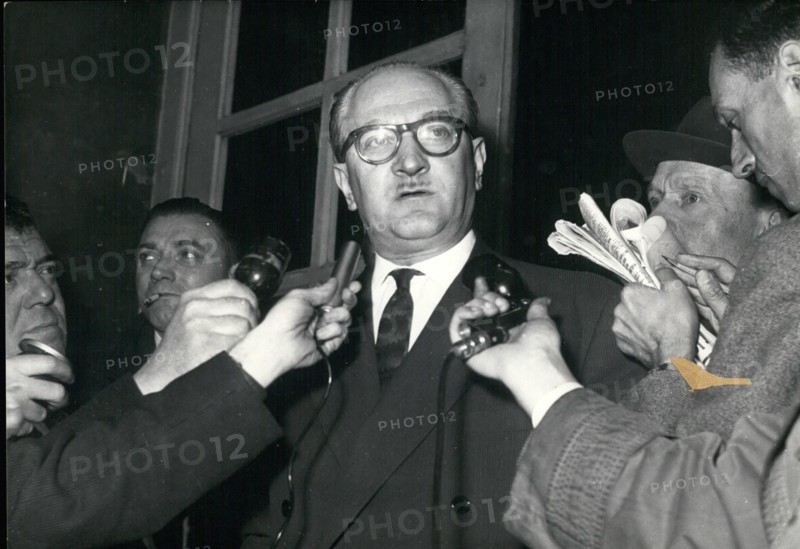 May 05, 1958 - Guy Mollet, who talked with Pierre Pflimlin, announced that he will accept the position of Council Vice-President. He is pictured making his announcement to the press. Germany - Policeman Being Bandaged.