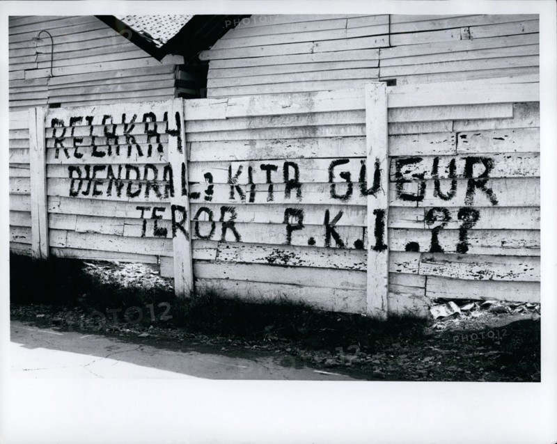 Oct. 10, 1965 - Indonesia: Djakarta - fence in city after aborted communist coup of Oct. 1, 1965, says that communist party is traitor to the Indonesian revolution and charges terror tactics. These signs were seen throughout countryside after the coup.