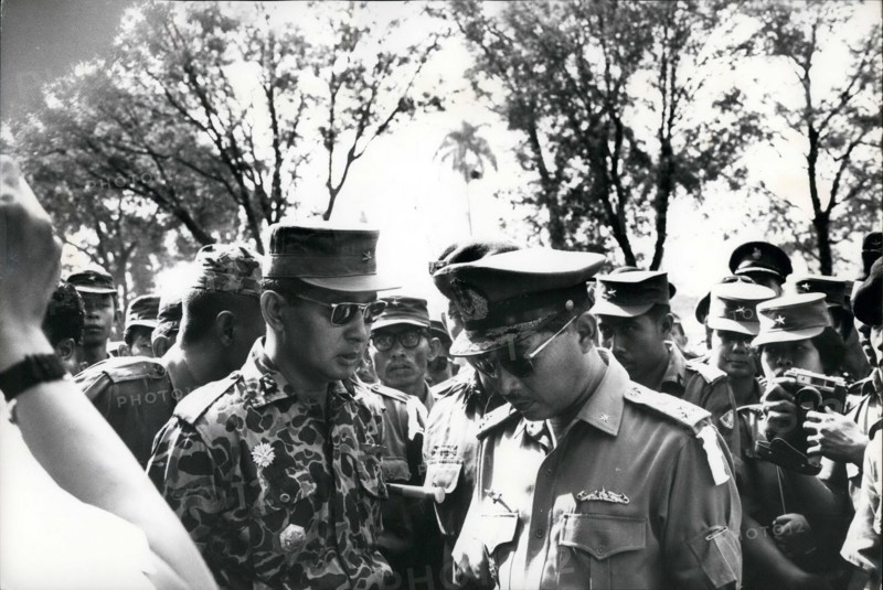 Feb. 24, 2012 - Grief exchanged - Maj. General Suharto (left) newly appointed Army Chief of Staff in Indonesia, talks with fellow officer outside Army Headquarters in Djakarta prior to funeral services October 5, 1965 for 6 generals slaughtered during Communist abortive coup of October 1. At time of picture, Suharto was commander of the Strategic Army Reserve. Speaking to Minister/Commander of the Navy, Vice Admiral R.E. Martadinata (Martadinata was replaced Feb 22nd 1966 by Vice Admiral Muliadi)