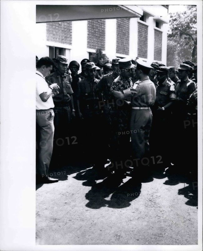 Feb. 28, 2012 - Grief stricken - Maj. General Suharto, newly appointed Army Chief of Staff in Indonesia, (in jungle suit) greets another officer at funeral services at Army Headquarters in Djakarta on October 5, 1965 for the 6 Indonesian generals massacred by communists during October 1 abortive coup.