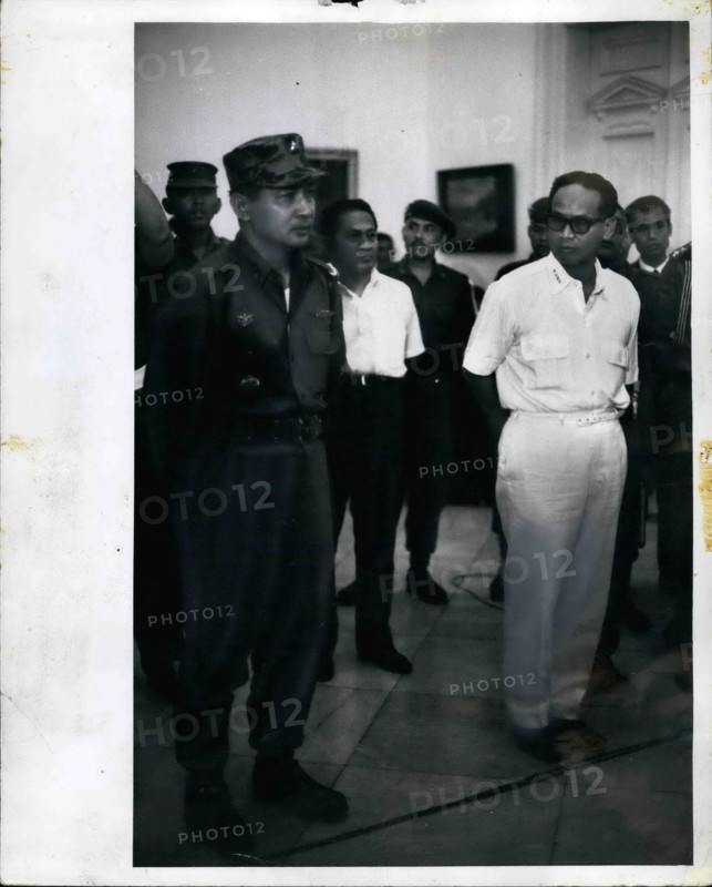 Feb. 28, 2012 - Maj. Gen Suharto (left in army uniform) at Istana Palace, Djakarta Indonesia, Oct. 14, 1965 when President Sukarno appointed him Army Chief of Staff. Suharto replaces Lt. gen Achmad yani, who was killed by the communists during the Oct. 1 aborted coup. In white, at right, is Dr. Subandario, 1st Deputy, Minister. An historic picture showing the two antagonists together (may be for the last time) with Suhato showing calm and resolution, while Subandario shows distrust and insecurity.