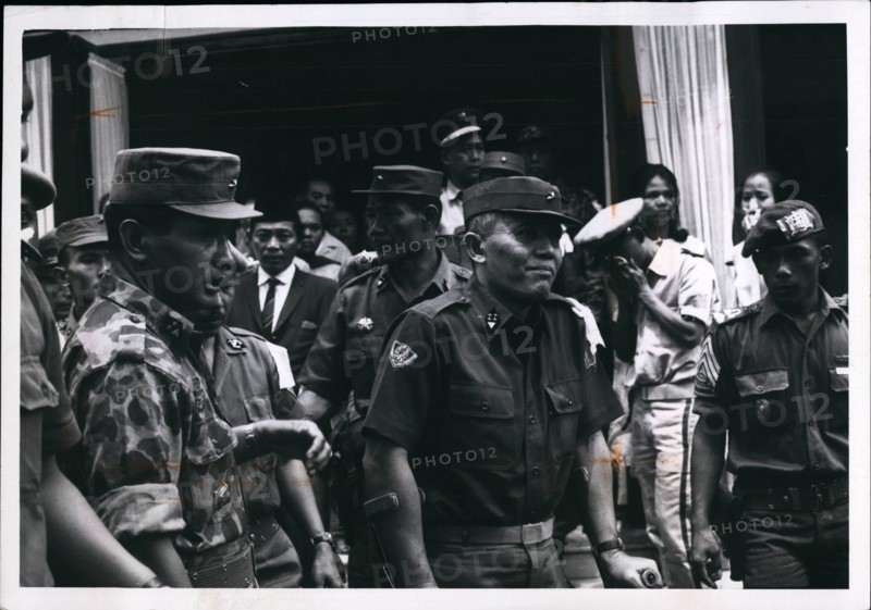 1965 - General Abdul Haris Nasuton, Centre, griefstricken, as he leaves his house in Djakarta for funeral of his 5-year-old daughter who was fatally wounded in the aborted communist coup of Oct 1, 1965. Nasution is Indonesian defense miniter. At left, in jungle uniform is Maj G n Suharto, who led military in crusihing the communist. he was later appointed army chief of staff. © Keystone Pictures USA/ZUMAPRESS.com/Alamy Live News