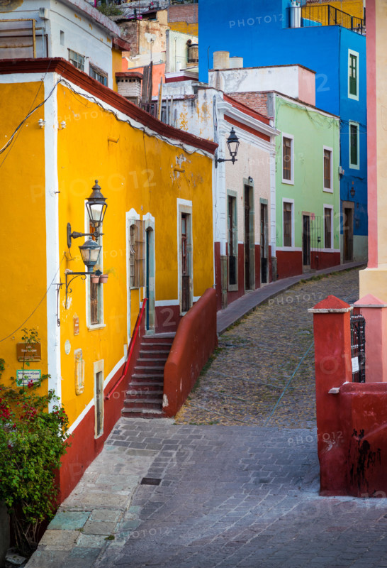 Typical colorful street in Guanajuato, Mexico with its Spanish colonial buildings. ------ Guanajuato is a city and municipality in central Mexico and