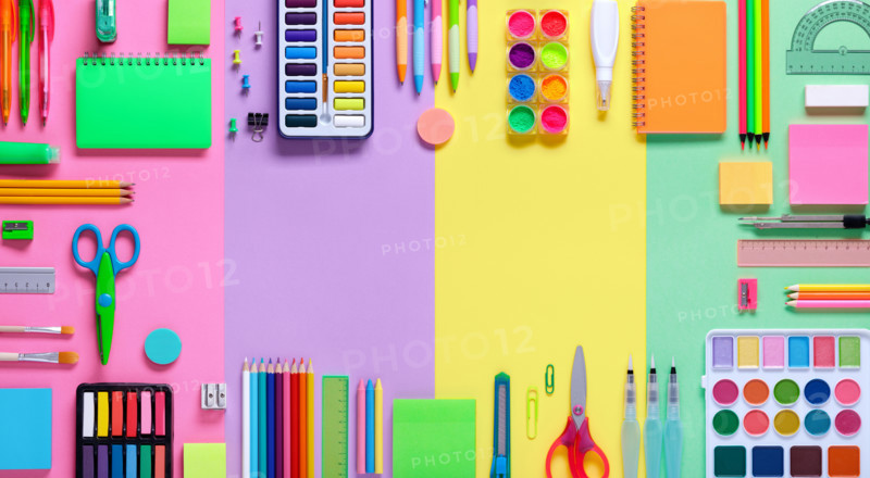 School Supplies In Frame With Colorful Paper Background
