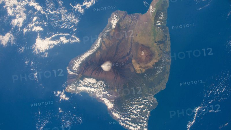 Aerial of the big island of Hawaii showing Kilauea, Mauna Loa, and Mauna Kea.