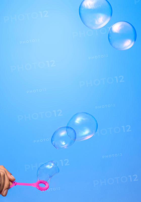 Soap bubbles on blue background