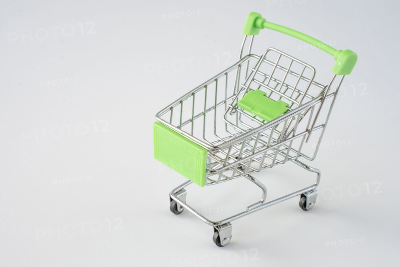 Small shopping cart on gray background. shopping concept. space for text