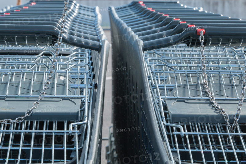 Wire modern supermarket shopping cart, symbol of consumerism in france