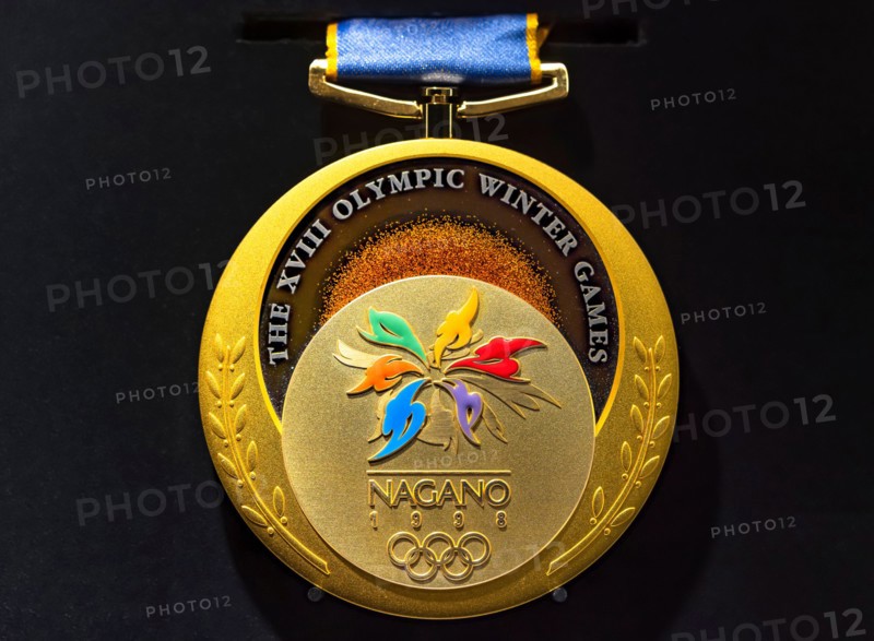 tokyo, japan - march 2 2021: Close up on the official gold medal used during the 1998 Winter Olympics of Nagano exhibited in the Japan Olympic Museum.