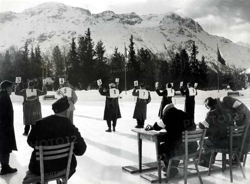 Jan 31, 1948; St. Moritz, SWITZERLAND; Judges hold up the score cards while judging in the Women's Singles Skating Championships during the 1948 St. Moritz Winter Olympics. (Credit Image: © KEYSTONE Pictures USA)