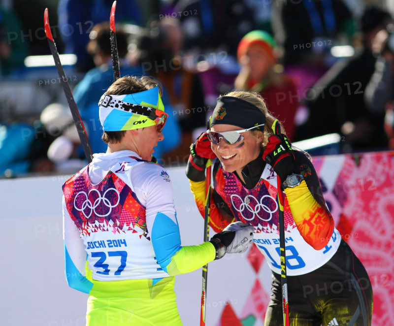 Sochi, RUSSIA – February 8, 2014: Claudia NYSTAD (GER) (R) at the finish of ladies' Skiathlon 7.5 km Classic + 7.5 km Free