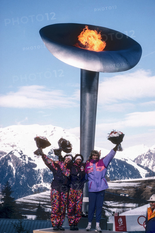 Doris Neuner (AUT)-C- gold medal winner in women's luge with sister Angelika Neuner (AUT) -L- silver and Susi Erdmann (GER) at the Olympic Flame flower ceremonies at the 1992 Olympic Winter Games, Albertville, France