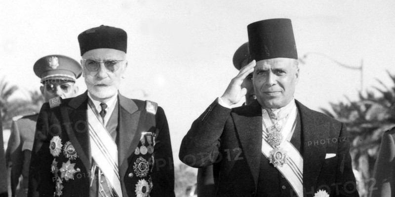 Tunisia achieves Independence in 1956. The Bey of Tunis with Tunisia's first Prime Minister Habib Bourguiba. Muhammad VIII al-Amin was the last Bey of Tunisia until he was deposed in 1957