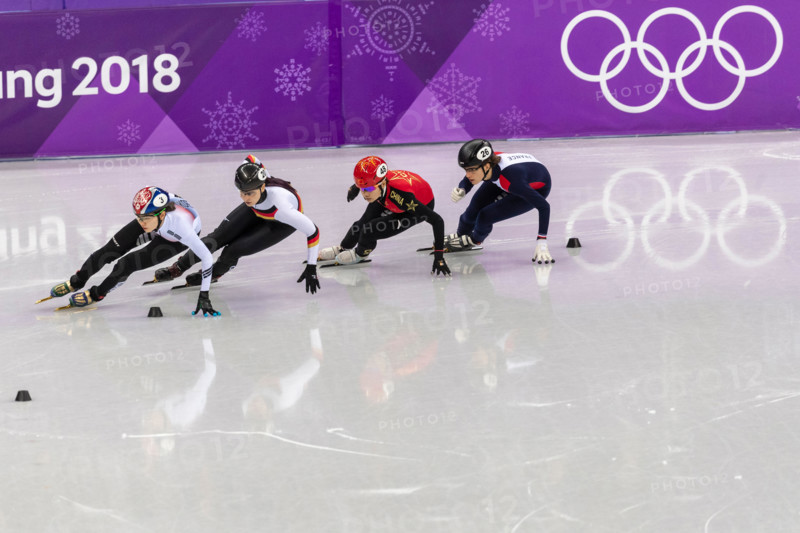 Han Yutong (CHN) #48, Bianca Walter (GER) #20, Veronique Pierron (FRA)#26 and Shim Sukhee (KOR) #3 competing in the Short Track women's 1000m heat #1