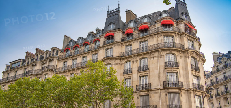 Eiffel tower between Parisian tenement old street alley and buildings, Paris