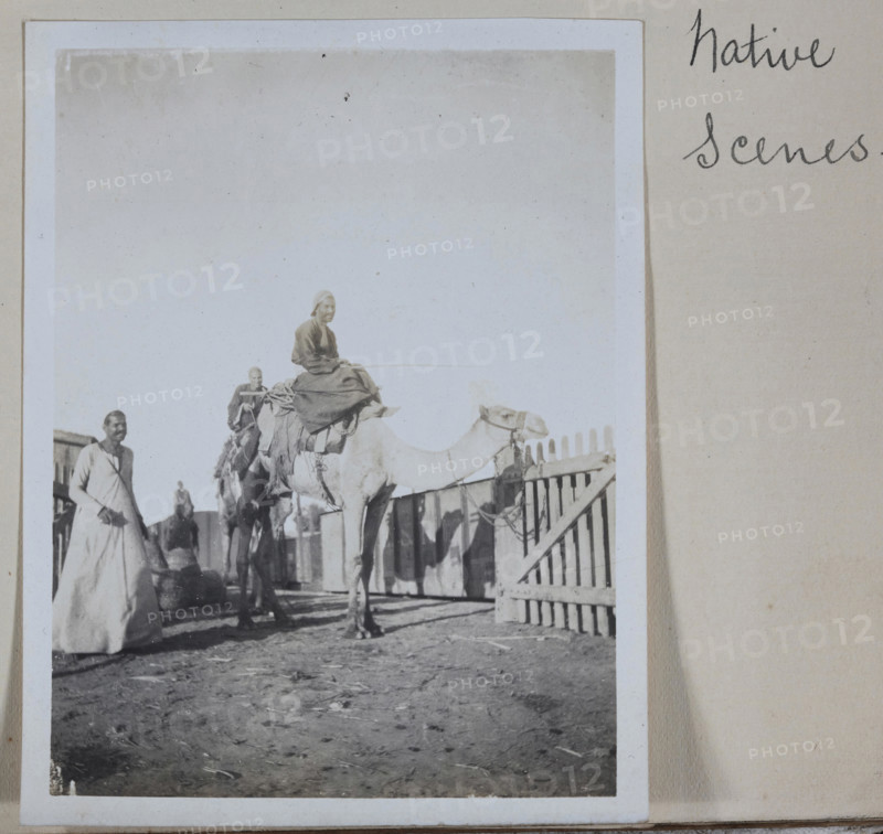 Photograph - Man on a Camel, Egypt, Captain Edward Albert McKenna, World War I, 1914-1915, One of 139 photographs in an album from World War I likely to have been taken by Captain Edward Albert McKenna. The photographs include the 7th Battalion training in Mena Camp, Egypt, and sight-seeing. Image depicting two men mounted on camels. According to one source Mena House, located near Mena Camp, held camel races that were popular with the Australian servicemen. It is possible that this