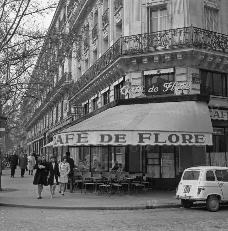 Pariser Bilder [The street life of Paris] Description: Café de Flore in Saint-Germain-des-Prés Annotation: District in the sixth and seventh arrondissement of Paris, traditionally populated by artists, students and intellectuals Date: 1965 Location: France, Paris Keywords: cafes, street images, terraces Institution name: Saint-Germain des Prés