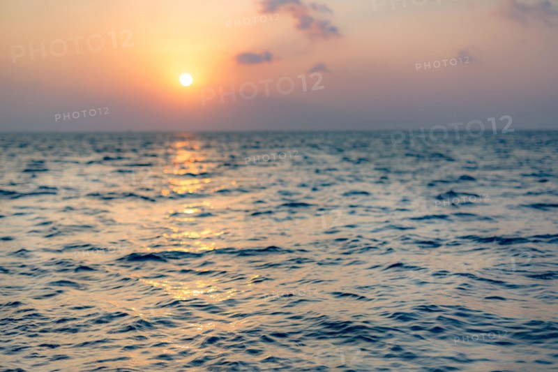 Sea on beautiful sunset, seascape. Vivid twilight sunset sky and motion blur of the sea under with long exposure effect.