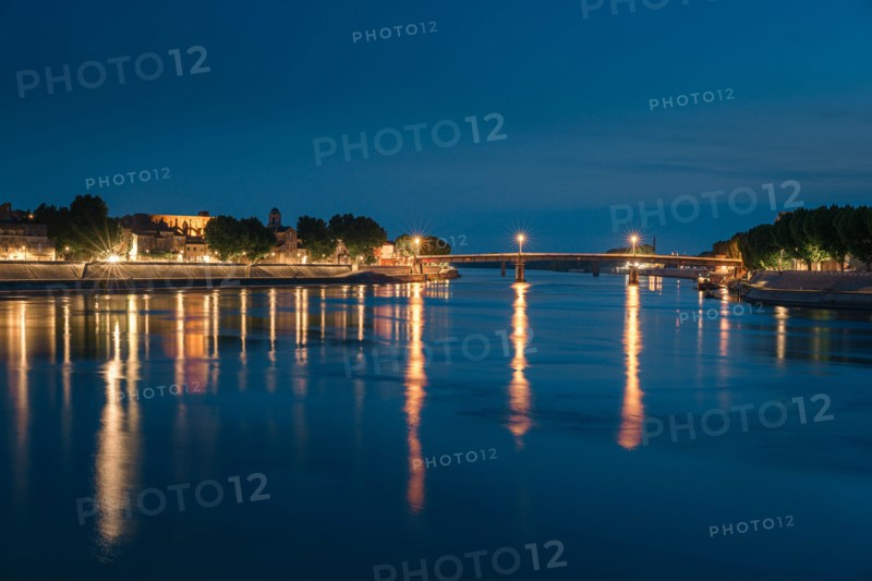 Night panoramic view of the French city, Arles on the River Rhône at night.