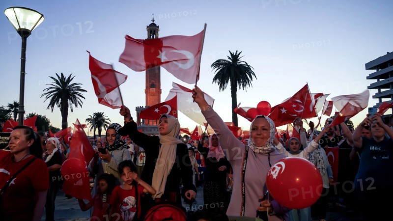 Turkey. 15th July, 2022. People with Turkish flags , some of them with President Erdogan and Ottoman flag attended July 15 Democracy and National Unity Day's events to mark July 15 defeated coup's anniversary at Konak Square. 249 people were martyred and nearly 2,200 people injured in the defeated 15th of July 2016 coup attempt. Credit: Idil Toffolo/Alamy Live News