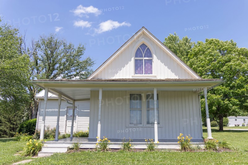 The American Gothic House was featured in the Grant Wood painting American Gothic. The house is in Eldon, Iowa, USA.