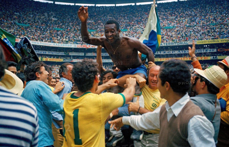 Pelé is carried on the shoulders of teammates after leading the Brazil national football team to victory over Italy national football team in the 1970 FIFA World Cup Final. Brazil won 4–1 to claim their third World Cup title