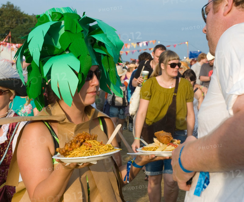 A woman with a plate of food at Bestival on the Isle of Wight