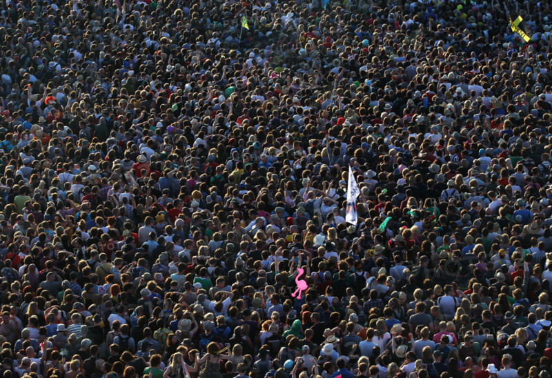 Festival-goers crowd around a stage to watch Pulp perform at The Glastonbury Festival in England 2011